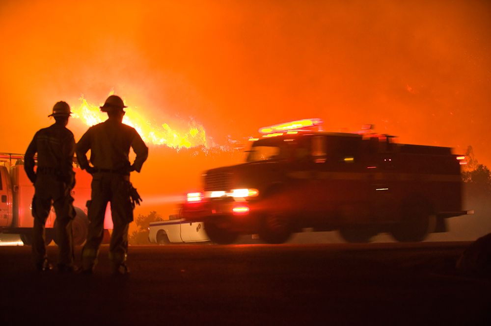 Firefighters Stand Watch As Fire Truck Passes While Jesusita Wildfire Burns In Santa California. art print by Kevin Steele for $57.95 CAD