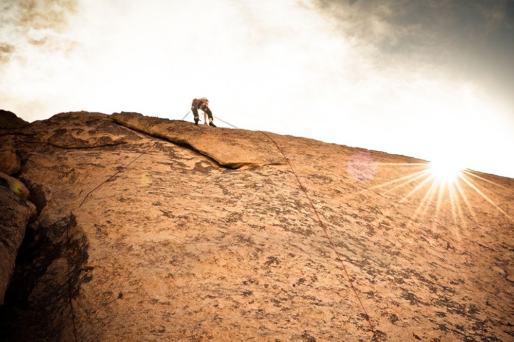 A Climber Nears The Top Of A Route In Joshua Tree. art print by Kevin Steele for $57.95 CAD