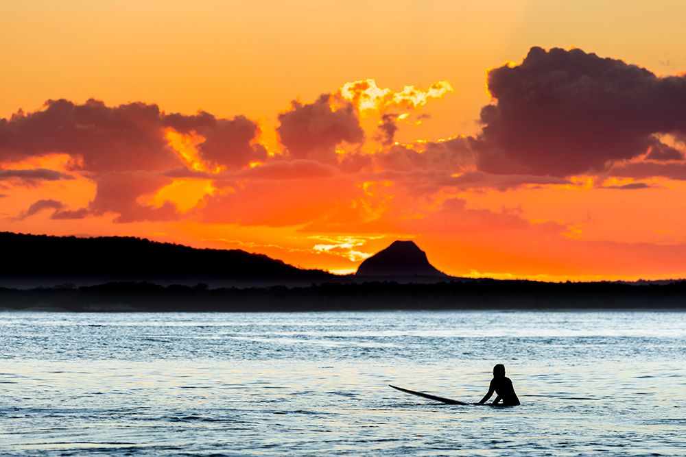 A Surfer Waits For A Wave At Sunset. art print by Andrew Peacock for $57.95 CAD