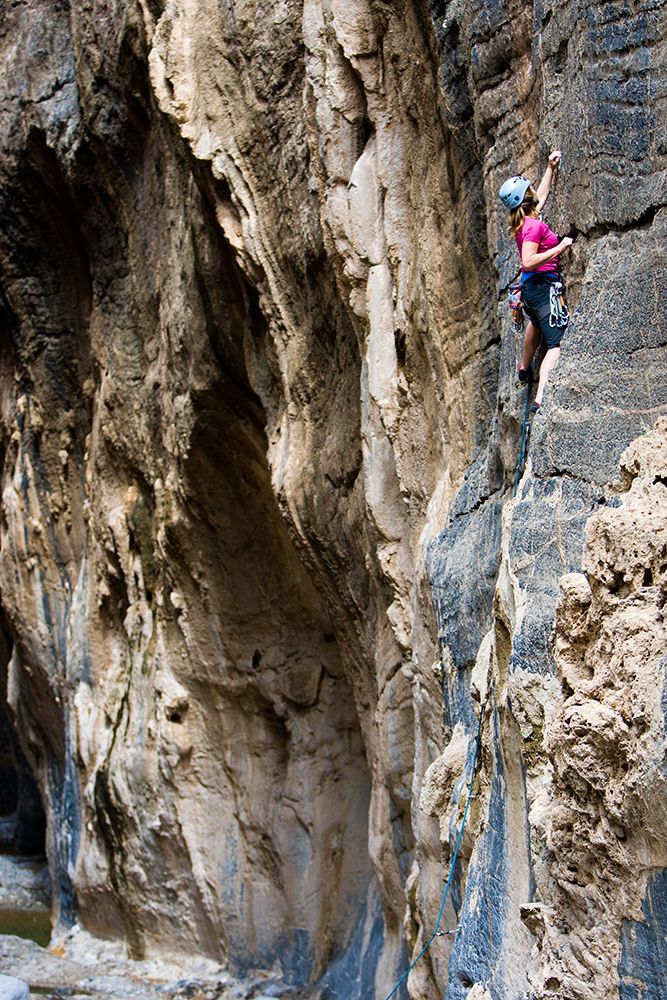 Female Rock Climbing In Oman. art print by Gabe Rogel for $57.95 CAD