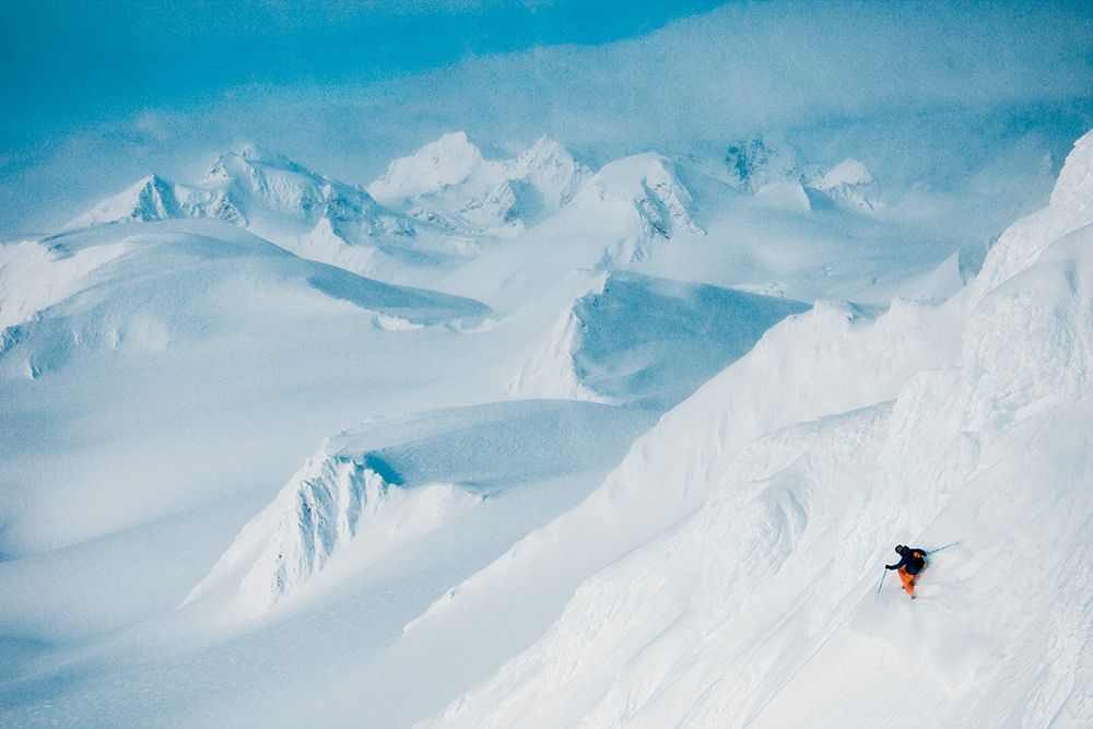 Man Skiing Down Steep Slope In Mountains. art print by Gabe Rogel for $57.95 CAD