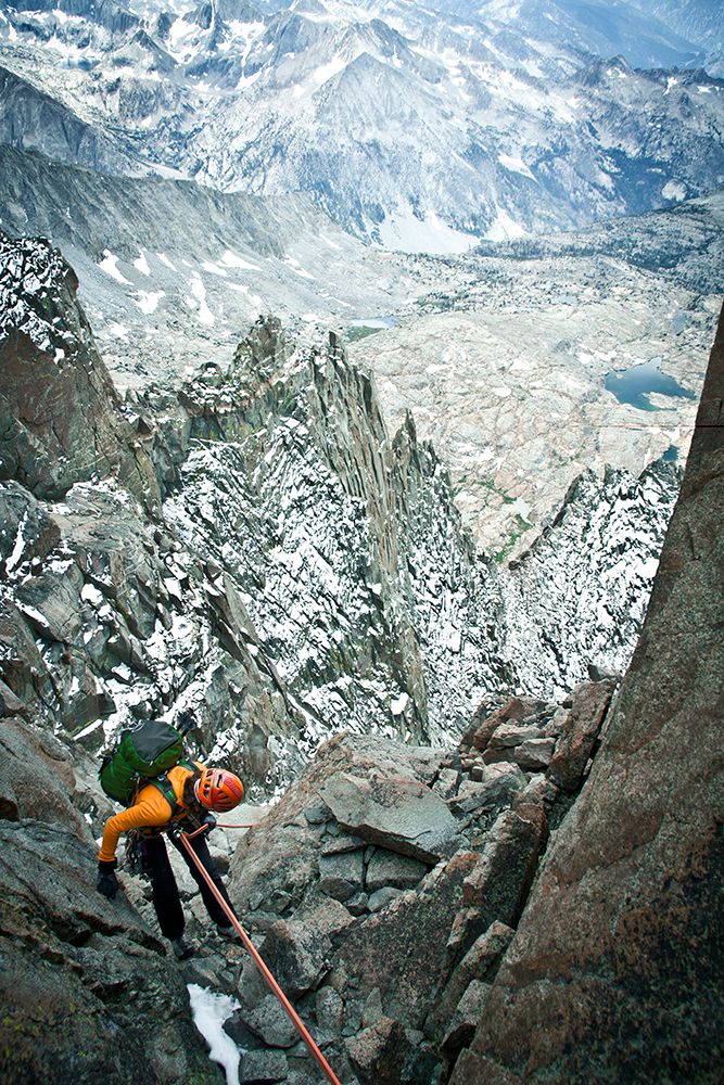 Woman Rock Climbing In Mountains, Rappelling Down Ledge. art print by Gabe Rogel for $57.95 CAD