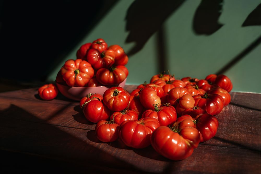 Bright Red Tomatoes On Kitchen Table In Window Light art print by Kristen Ryan for $57.95 CAD