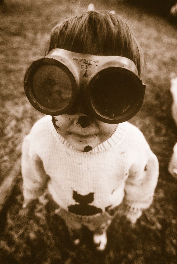 View Of Young Girl With Goggles And Smudges On Her Face While Playing In Mud In Federal Washington. art print by Earl Harper for $57.95 CAD