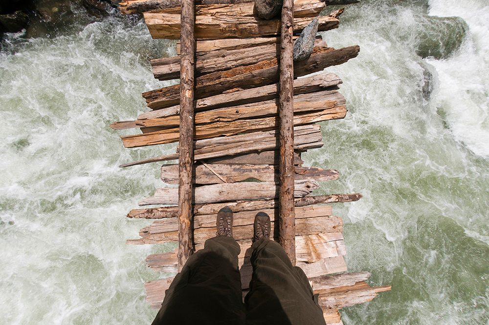 Point Of View Shot Looking Down Of Trekker Crossing Swollen Kanka River On Rickety Wodden India art print by Steve MacAulay for $57.95 CAD