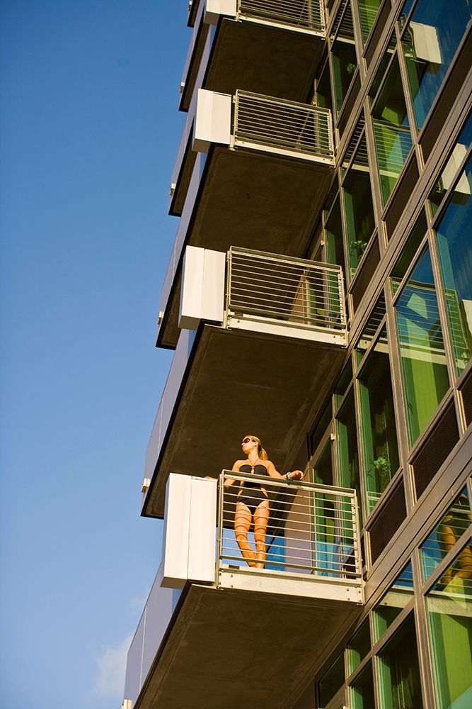 Fashion Model In A Black Bathing Suit Poses On The Balcony Of A Hotel Room In San Diego, California. art print by Jay Reilly for $57.95 CAD