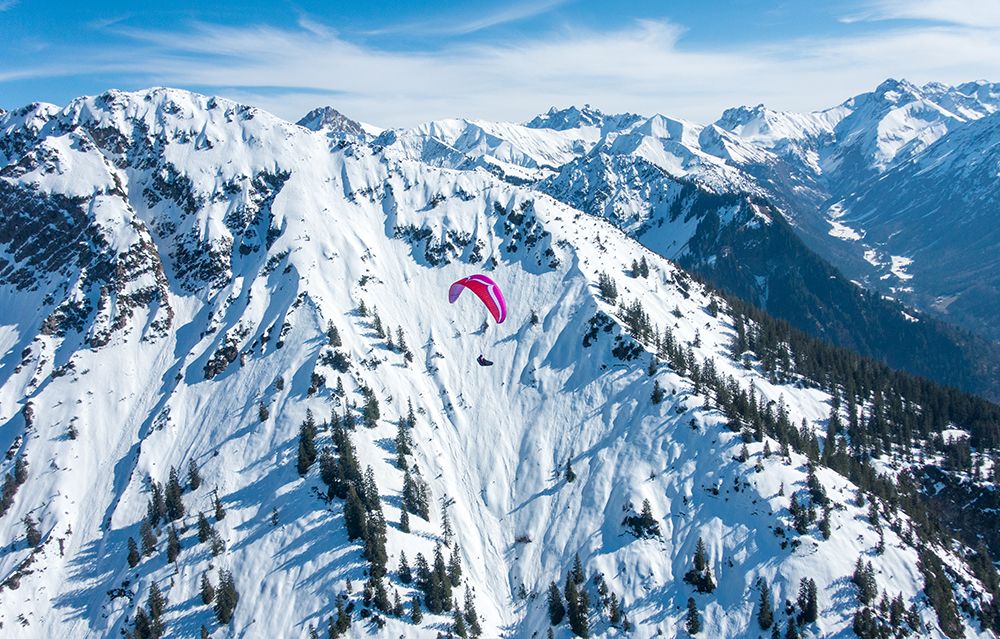 Experience Thrill Of Winter Paragliding Over Snowy Mountain Peaks: Breathtaking Views And Await art print by Max Seigal for $57.95 CAD