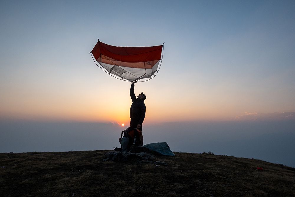 Elevate Your Adventure: Paraglider Enthusiast Embraces The Sunrise On A Mountain Summit art print by Max Seigal for $57.95 CAD