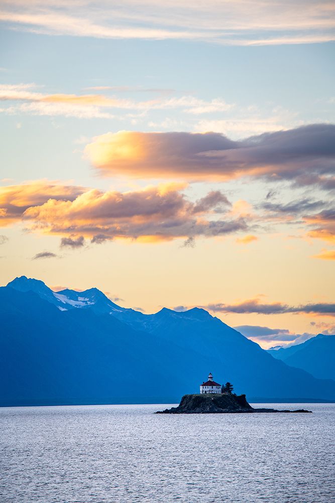 Explore Majestic Coastal Beauty: Breathtaking Lighthouse Against Stunning Mountain Backdrop Sunset art print by Max Seigal for $57.95 CAD