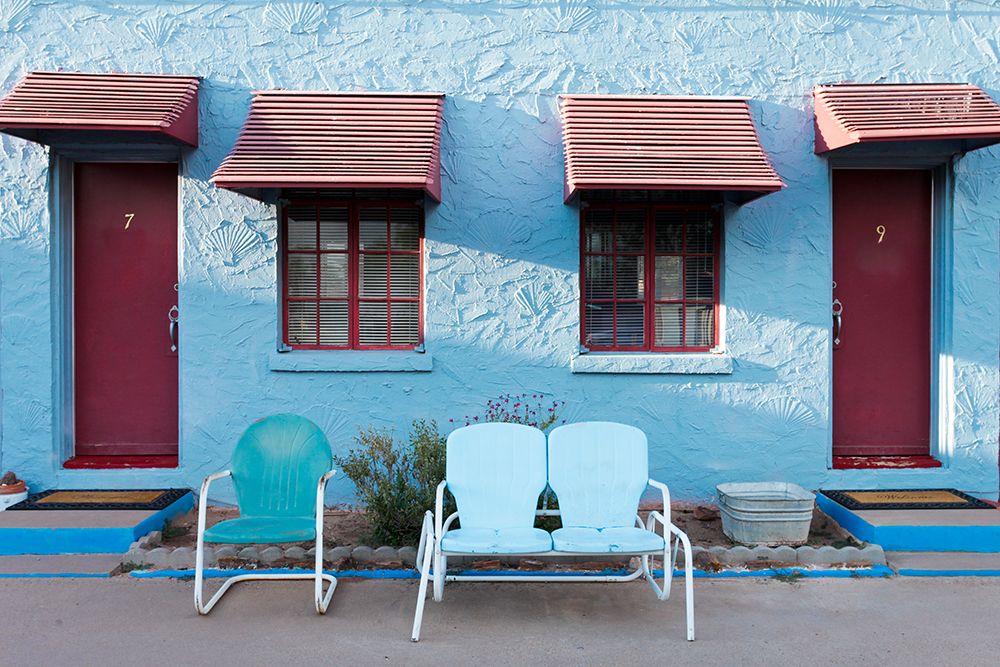 Tucumcari,New Mexico. Famous Blue Swallow Motel On Route 66. Motel Exterior With Old Metal Chairs art print by Julien McRoberts for $57.95 CAD