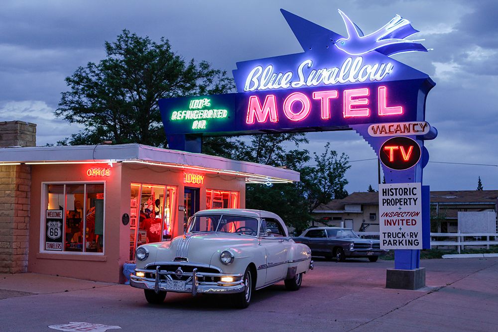 Tucumcari,New Mexico. Famous Blue Swallow Motel On Route 66 With Old Car Parked In Front. art print by Julien McRoberts for $57.95 CAD