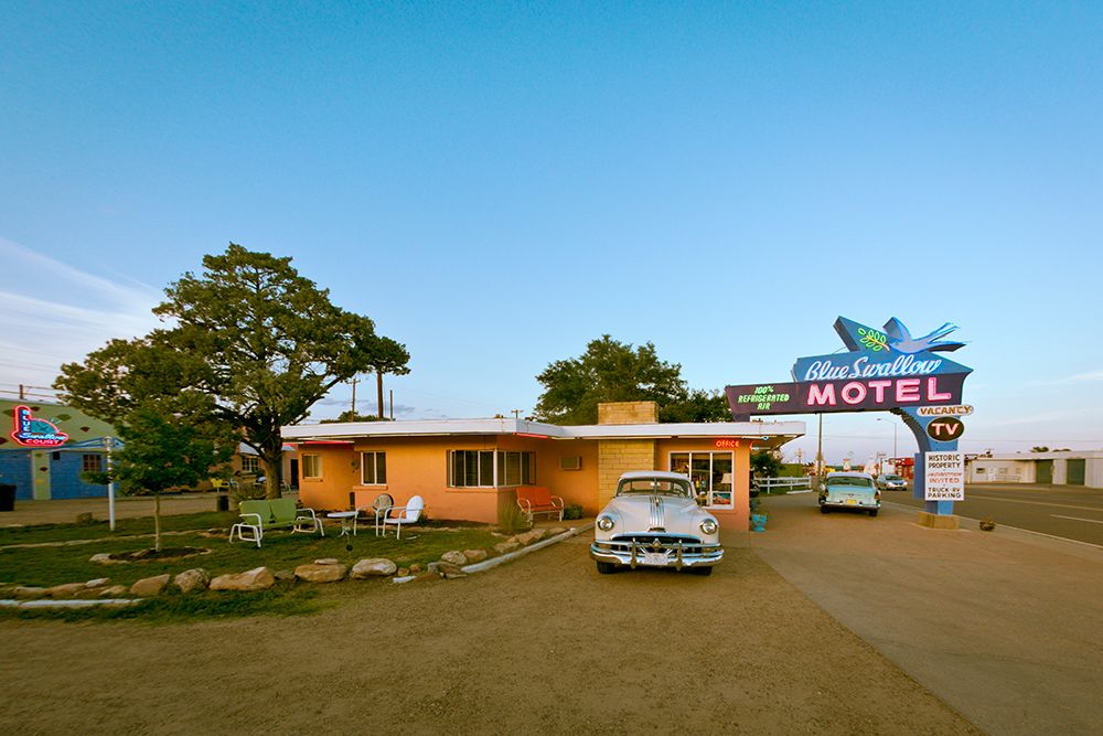 Tucumcari,New Mexico. Famous Blue Swallow Motel On Route 66 With Old Car Parked In Front. art print by Julien McRoberts for $57.95 CAD