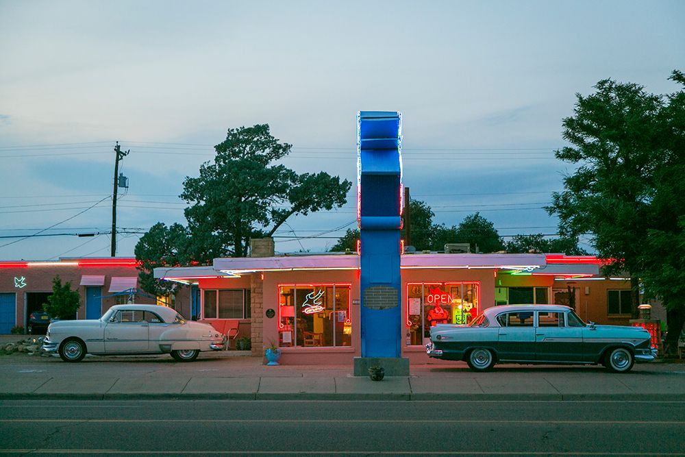 Tucumcari,New Mexico. Famous Blue Swallow Motel On Route 66 With Old Car Parked In Front. art print by Julien McRoberts for $57.95 CAD