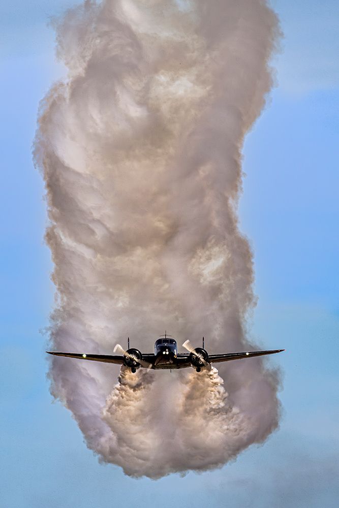Matt Yonkin, In His Beech 18 Cargo Aircraft, Turned Stunt Plane, Streaks Across Sky Leaving Smoke art print by Larry W Richardson for $57.95 CAD