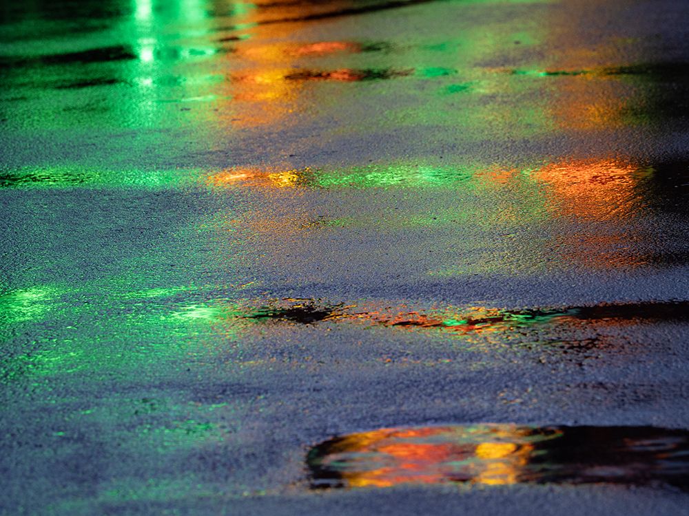 Lights reflected in puddles on asphalt path art print by Merrill Images for $57.95 CAD