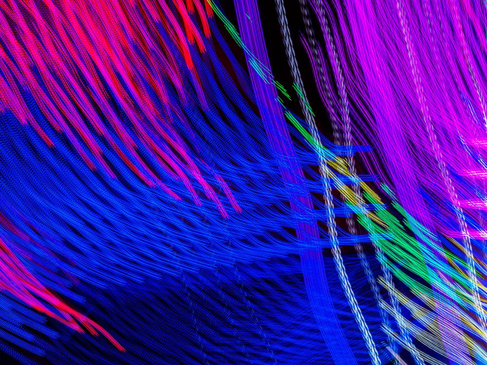 Colorful motion blur abstract of a ride at a carnival. art print by Merrill Images for $57.95 CAD