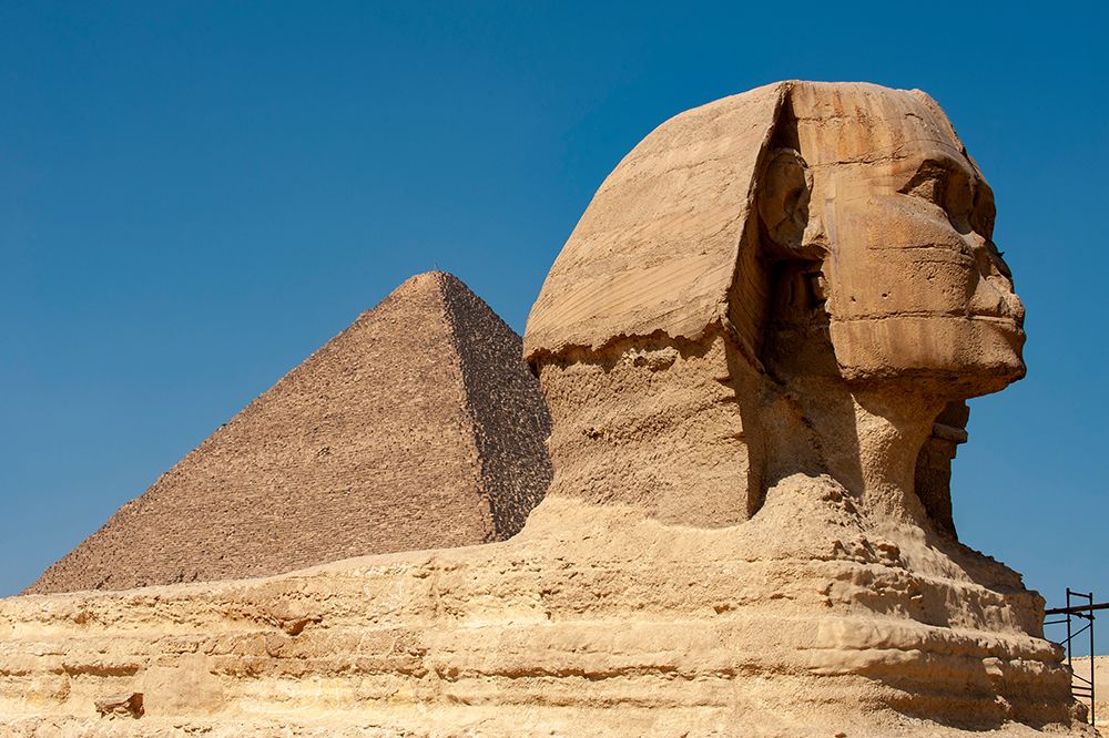 Africa, Egypt, Giza. Classic view of the Sphinx and one of the great Pyramids of Giza. art print by Alison Wright for $57.95 CAD