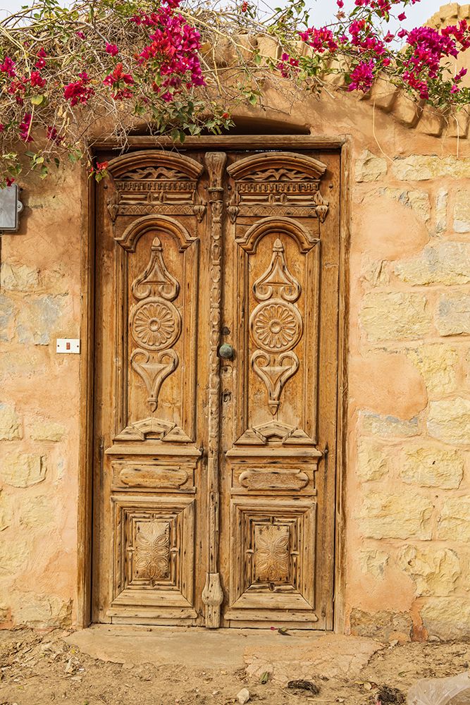 Faiyum-Egypt Wooden door in a wall art print by Emily M. Wilson for $57.95 CAD