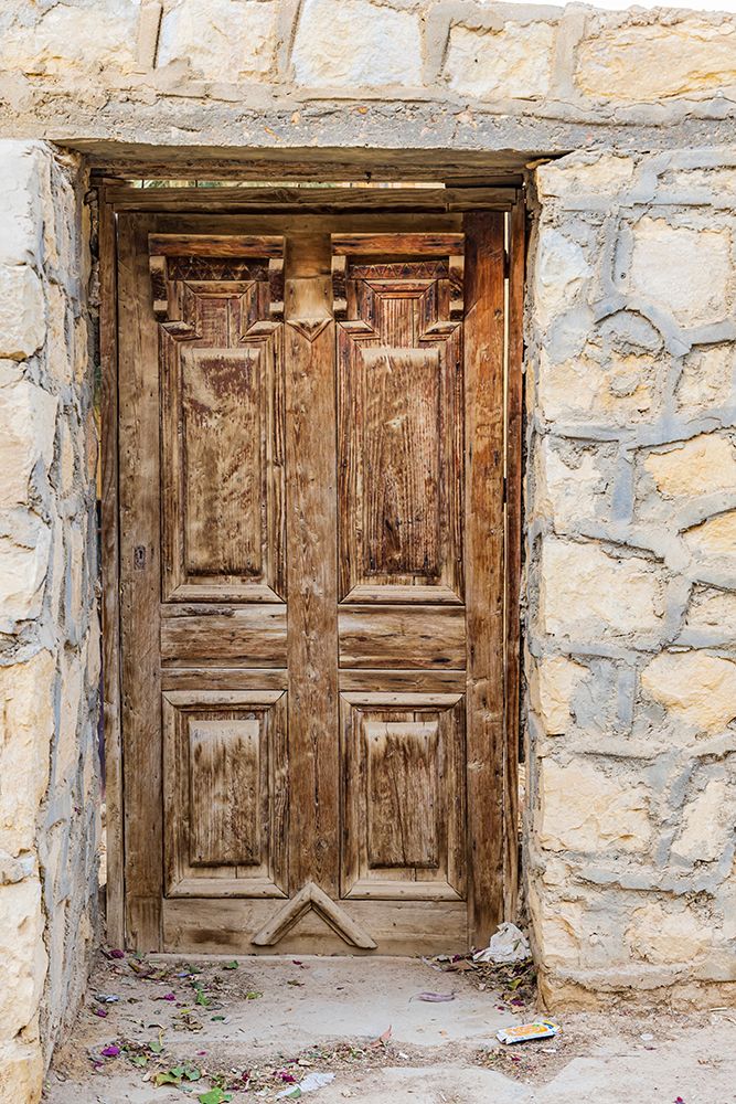 Faiyum-Egypt Wooden door in a wall art print by Emily M. Wilson for $57.95 CAD