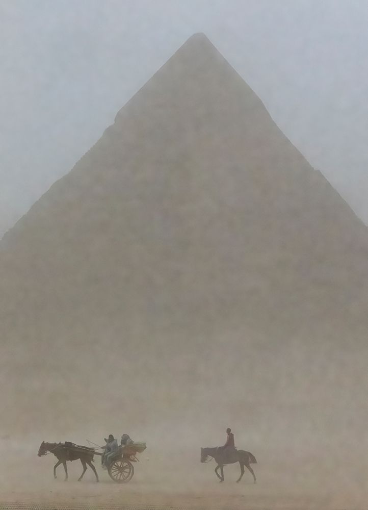 Riders in sandstorm. Pyramids of Giza-Egypt. art print by Tom Norring for $57.95 CAD