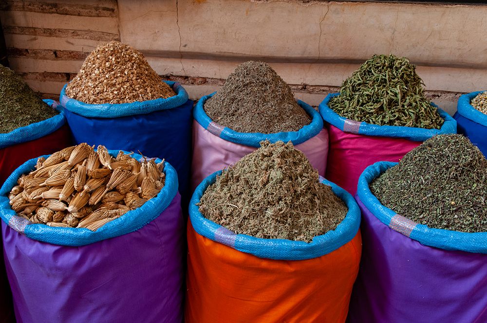 Colorful bags of spices for sale at the Medina Souk Marrakech-Morocco art print by Sergio Pitamitz for $57.95 CAD