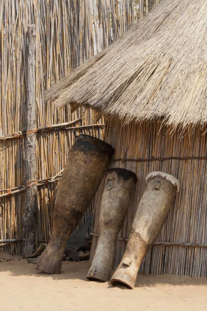 Namibia, Caprivi Strip Tribal drums lean on hut art print by Wendy Kaveney for $57.95 CAD