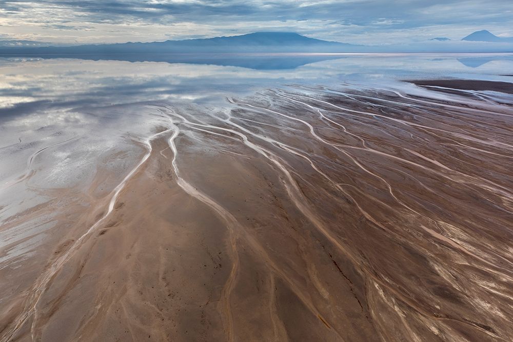 Africa-Tanzania-Aerial view of streams winding along shore and distant Ol Doinyo Lengai volcano art print by Paul Souders for $57.95 CAD