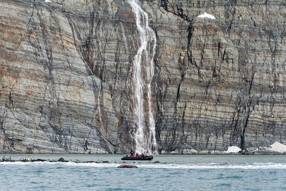 Zodiac approaching waterfall and king penguins on the beach-Gold Harbour-South Georgia-Antarctica art print by Keren Su for $57.95 CAD