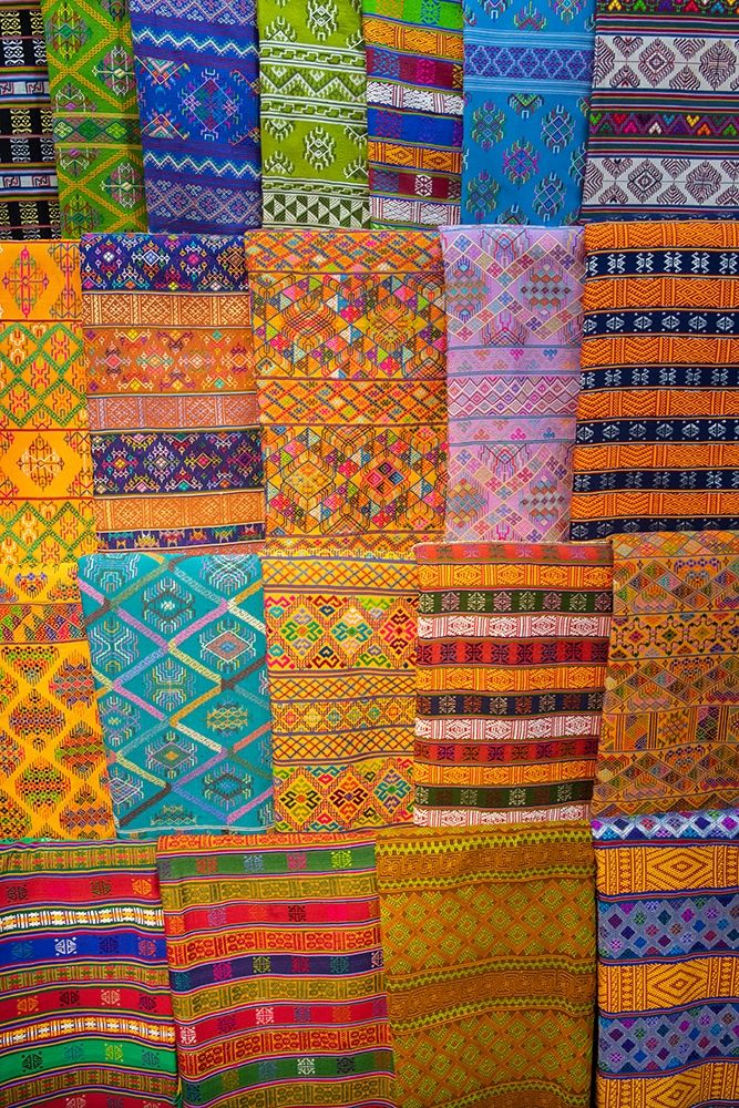 Bhutan-Thimphu Traditional colorful and ornate hand woven textiles art print by Cindy Miller Hopkins for $57.95 CAD