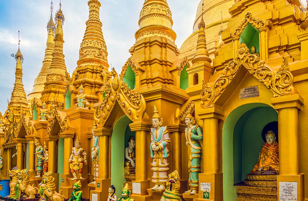 Shwedagon Pagoda, Yangon, Myanmar. Buddhist statues and mini temples at Shwedagon Pagoda. art print by Murray McCallum for $57.95 CAD