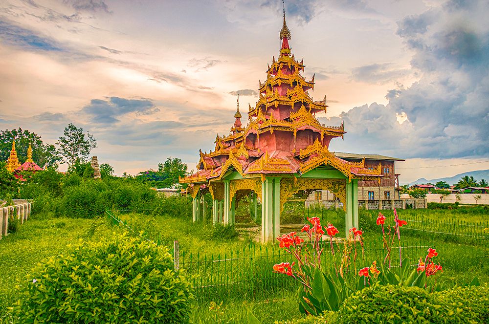 Nyaungshwe, Myanmar, Asia, small Buddhist pagoda at sunset sitting in fenced field. art print by Murray McCallum for $57.95 CAD