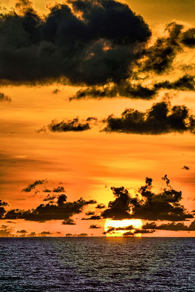 Golden light of the setting sun reflects a red glow on the beach at Pererenan Beach-Bali art print by Greg Johnston for $57.95 CAD