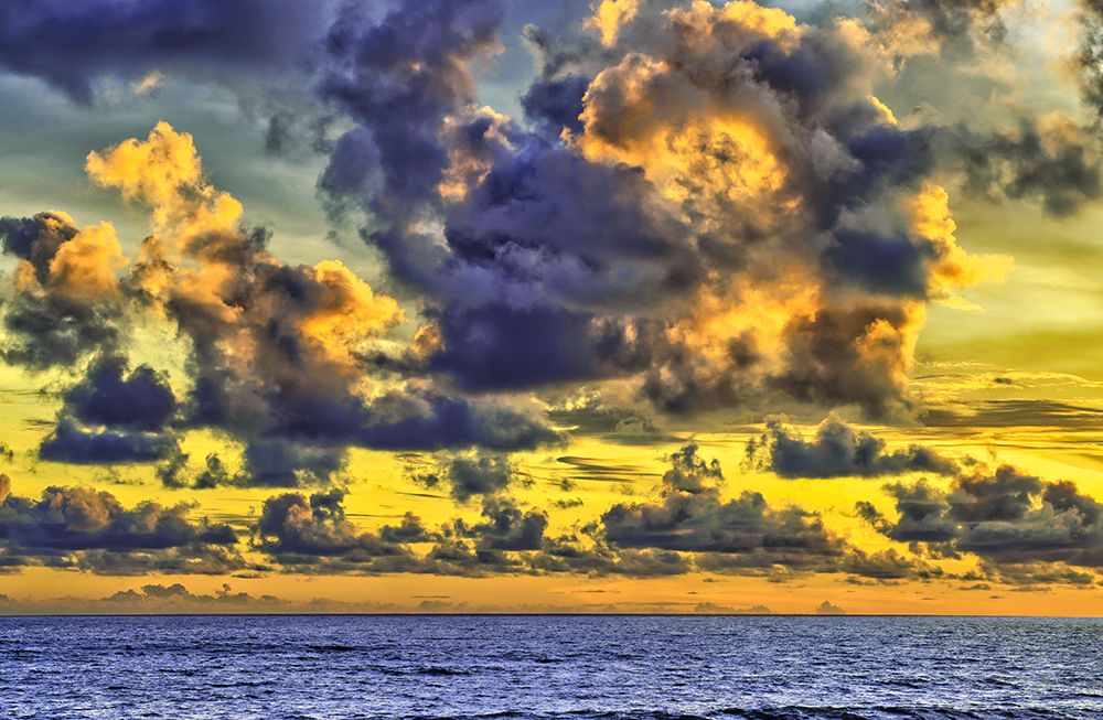 Golden light of swirling clouds sunset reflects a pink glow on the beach at Pererenan Beach-Bali art print by Greg Johnston for $57.95 CAD