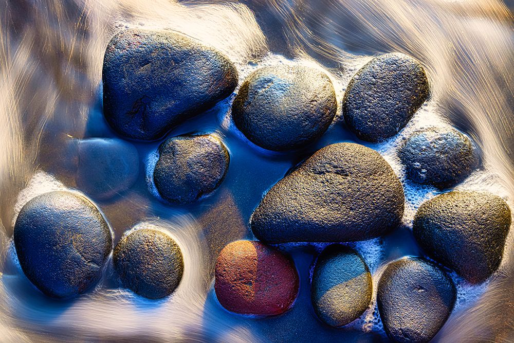Lava beach rocks worn by centuries of sea water cover the black sand beaches of Bali art print by Greg Johnston for $57.95 CAD