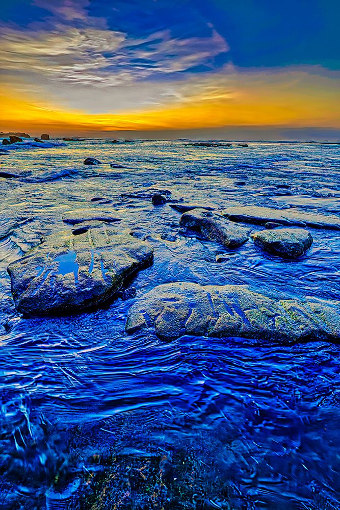Indonesia. Sunset light can be absorbed and reflected by the black sand. art print by Greg Johnston for $57.95 CAD