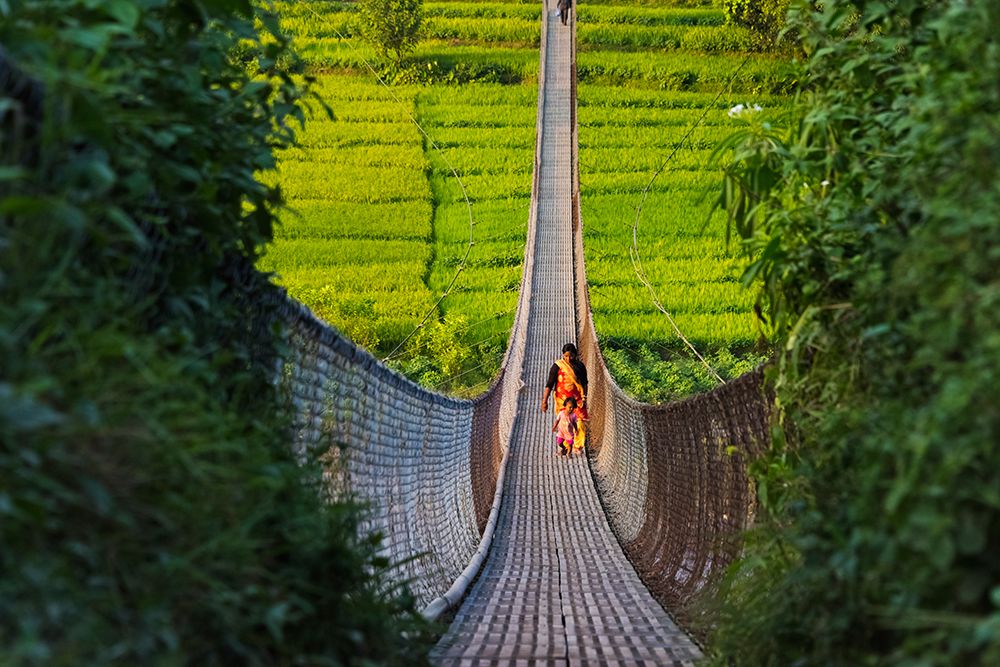 People crossing suspension bridge over Trishuli River-Tupche-Nuwakot District-Province 3-Nepal art print by Keren Su for $57.95 CAD