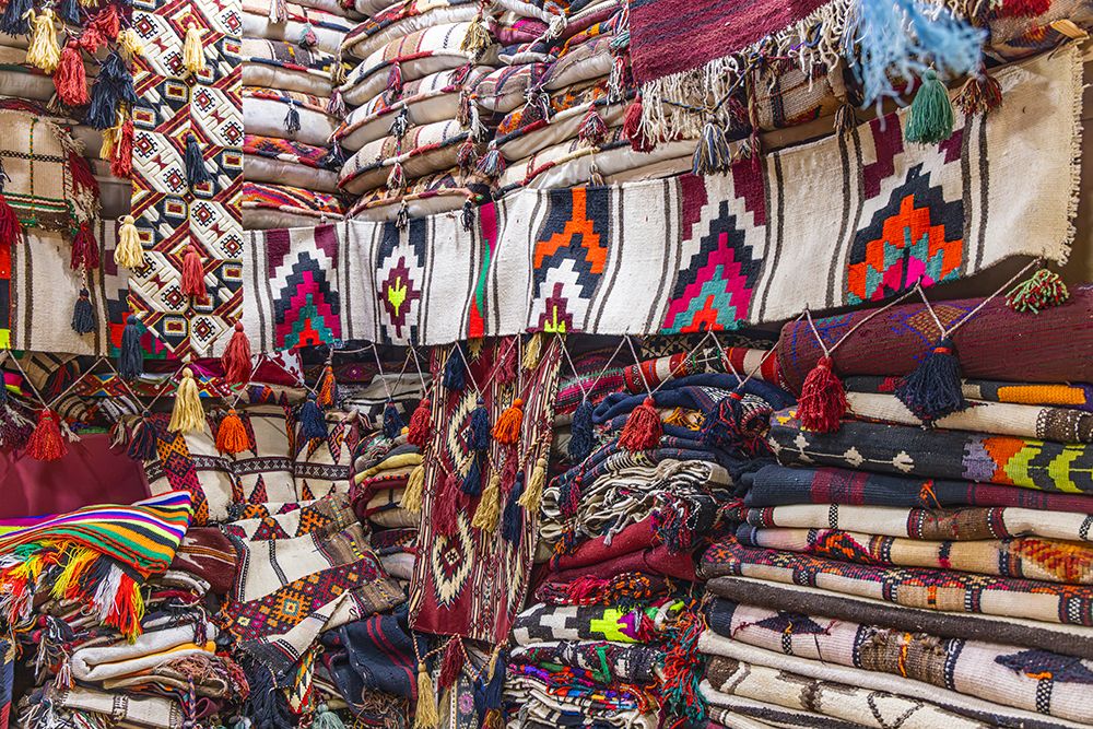Saudi Arabia, Riyadh, Al-Dirah. Blankets, pillows and rugs at the Souq Al-Zal. art print by Emily M. Wilson for $57.95 CAD