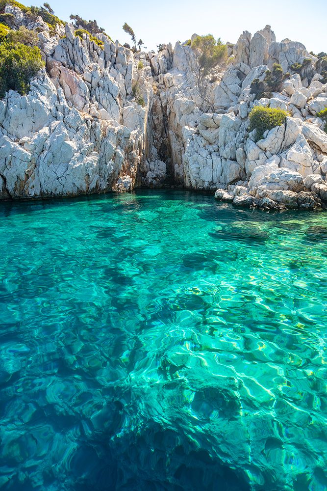 Turquoise colored crystal clear water at a rocky island-Aegean Sea-Turkey art print by Ali Kabas for $57.95 CAD