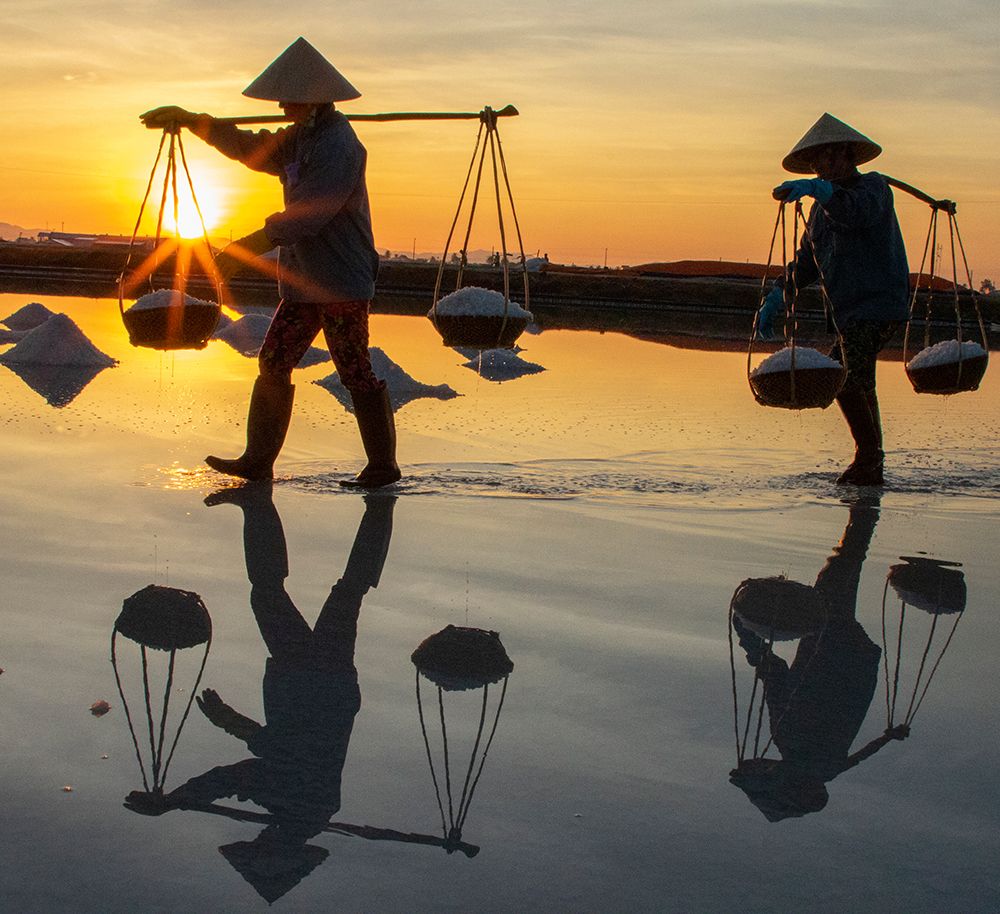 Vietnam-Doc Let Salt lake-Workers harvesting the salt-Early morning sunrise art print by Tom Norring for $57.95 CAD