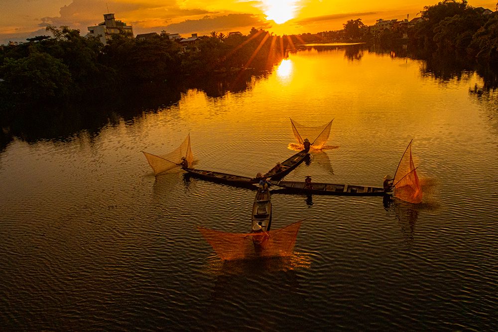 Vietnam-Coordinated lagoon fishing with nets at sunset art print by Tom Norring for $57.95 CAD