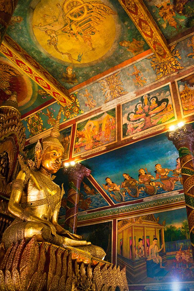 Cambodia. Wat Phnom is the cities highest point in Phnom Penh. Statues inside the temple. art print by Micah Wright for $57.95 CAD