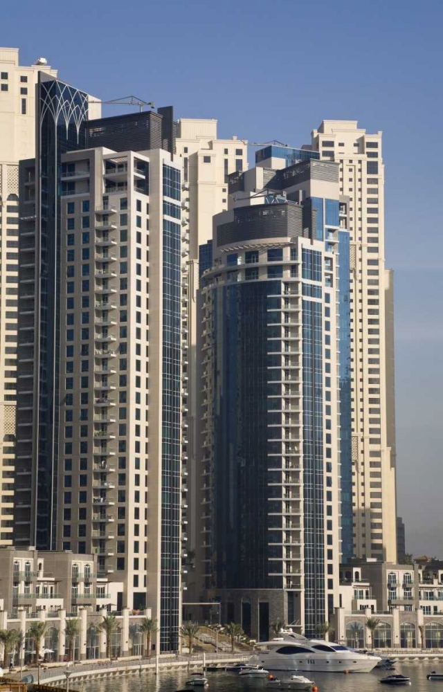 UAE, Dubai Marina towers with boats at anchor art print by Bill Young for $57.95 CAD