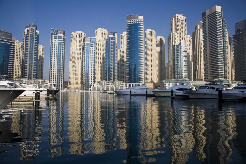 UAE, Dubai Marina towers with boats at anchor art print by Bill Young for $57.95 CAD