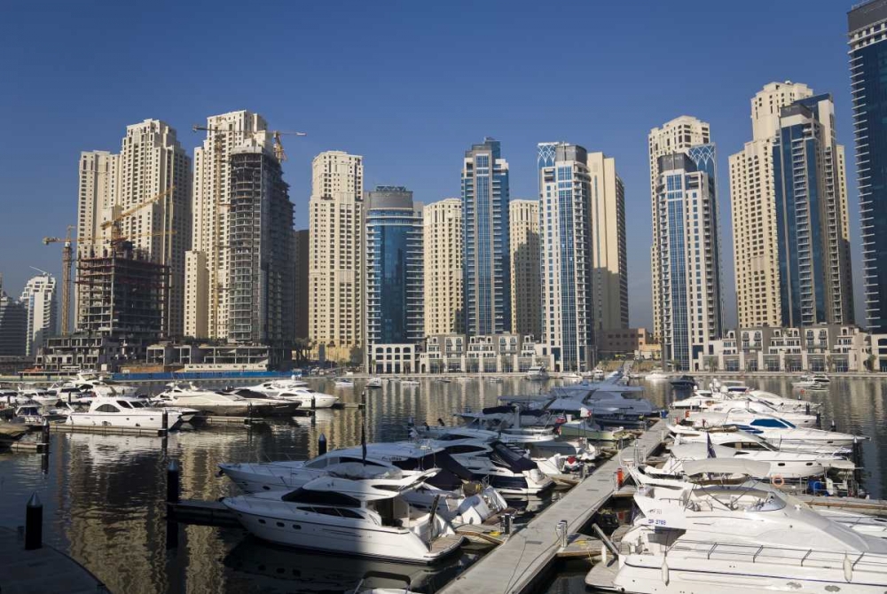 UAE, Dubai Marina towers with boats at anchor art print by Bill Young for $57.95 CAD