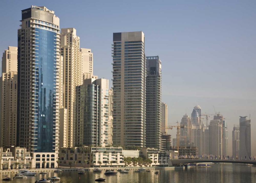 UAE, Dubai Marina towers with boats at anchor art print by Bill Young for $57.95 CAD