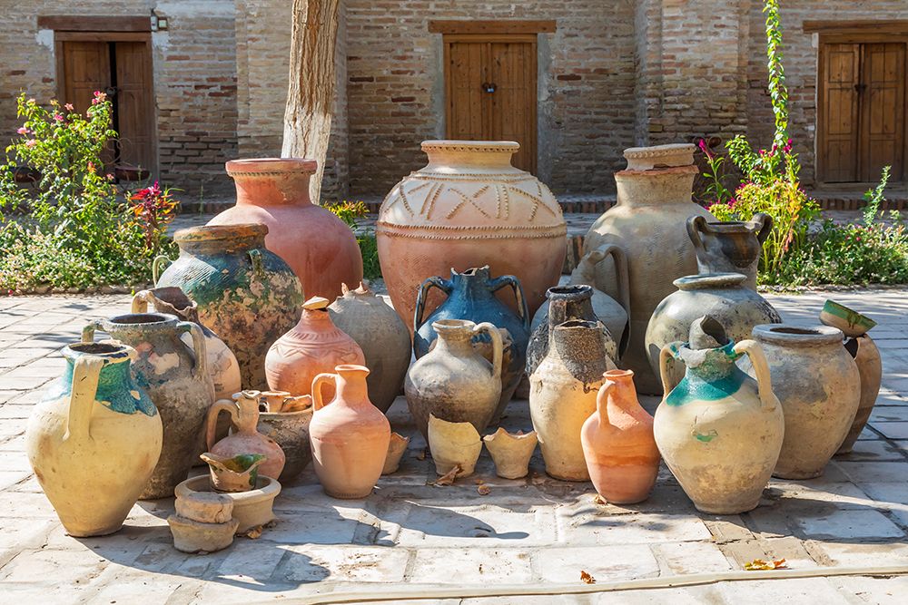 Bukhara, Uzbekistan, Central Asia. Variety of pots in a courtyard in Bukhara. art print by Emily M. Wilson for $57.95 CAD