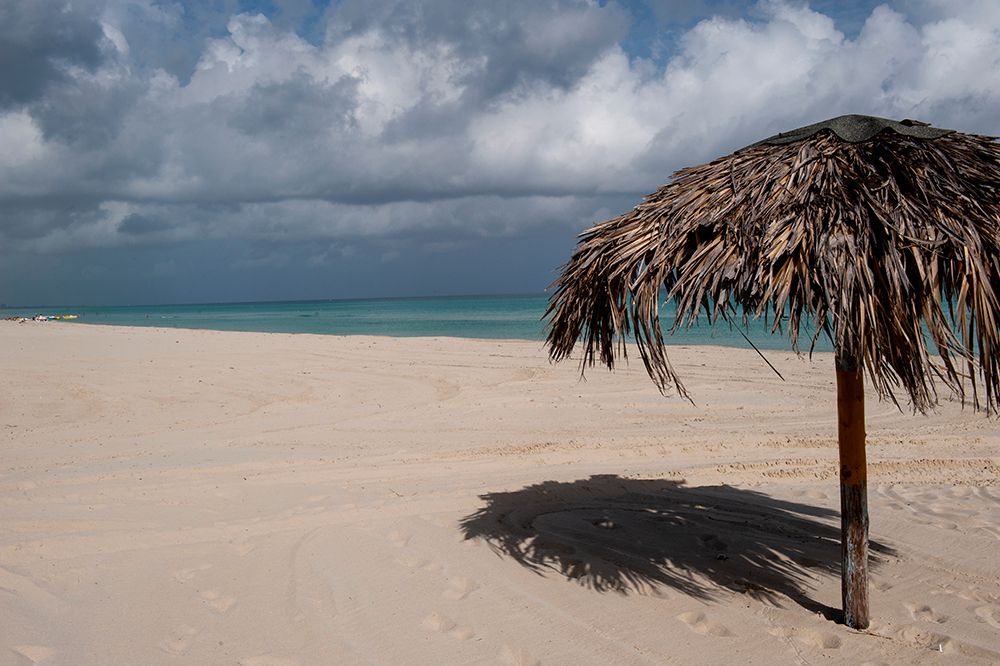 Varadero Beach, Cuba. The empty tropical beach clad with thatched umbrellas for tourists. art print by Alison Wright for $57.95 CAD