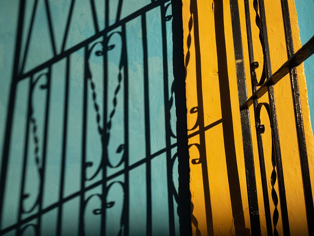 Cuba-Camaguey-UNESCO World Heritage Site-wrought iron gate and colorful walls art print by Merrill Images for $57.95 CAD