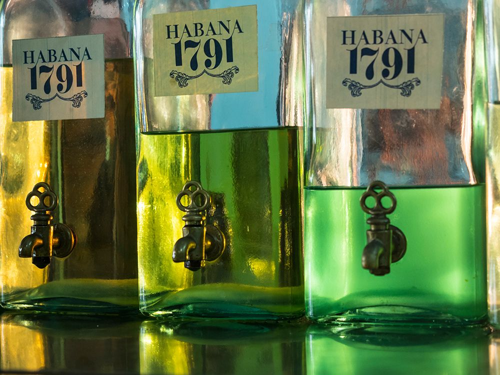 Cuba-Havana-Havana Vieja-UNESCO World Heritage Site-bottles in perfumery art print by Merrill Images for $57.95 CAD