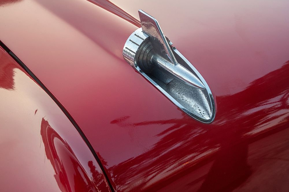Detail of hood ornament of red 57 Chevrolet Bel Air in Habana-Havana-Cuba art print by Janis Miglavs for $57.95 CAD